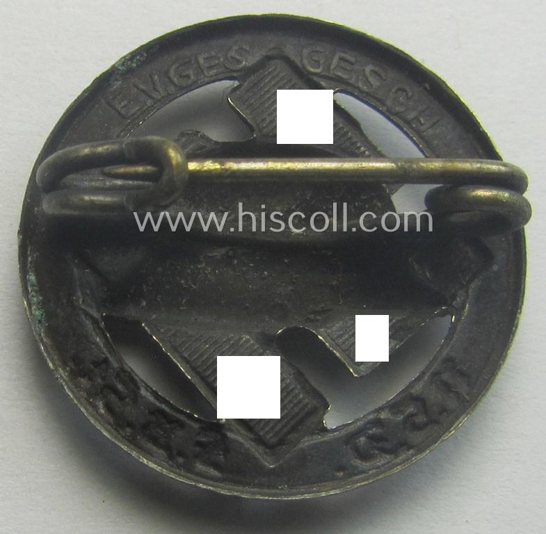 Membership lapel-pin: 'Nationalsozialistischer Deutscher Frontkämpferbund Stahlhelm' (or: 'N.S.D.F.B.St.') being a very detailed- and/or: maker- (ie. 'E.V.' - 'Ges.Gesch'-) marked example that is executed in silver-toned 'Buntmetall'