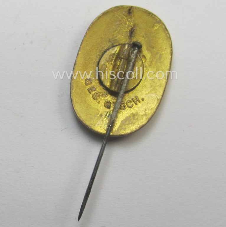 Bright orange-coloured and neatly enamelled 'Reichsarbeitsdienst'- (ie. RAD-) related lapel-pin (ie. 'Ehrennadel') entitled: 'Arbeitsdank' (that shows a 'Ges.Gesch.'-patent-pending-marking on its back)
