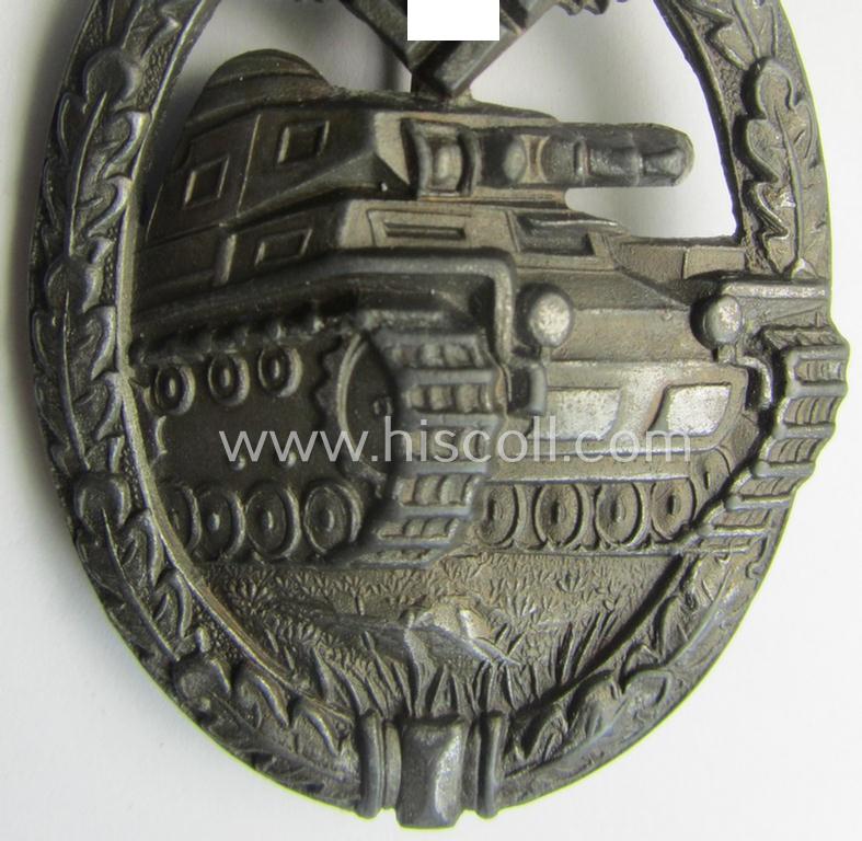 'Panzerkampf-Abzeichen in Bronze' being a 'hollow-back', non-maker-marked- (and/or: zinc- ie. 'Feinzink'-) based example as was procuced by the: 'C.E. Juncker'-company