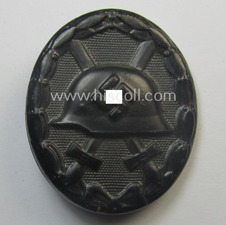 'Verwundeten-Abzeichen in Schwarz' being a maker- (ie. '4'-) marked example by the: 'Steinhauer & Lück'-company that came stored in its (scarcely seen!) period pouch