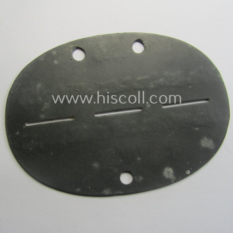 Zinc-based, WH (Heeres) ie. 'leichte Artillerie'-related ID-disc bearing the clearly stamped unit-designation: 'St./le.Ar.Ers.u.Ausb.Abt.(mot) 33'