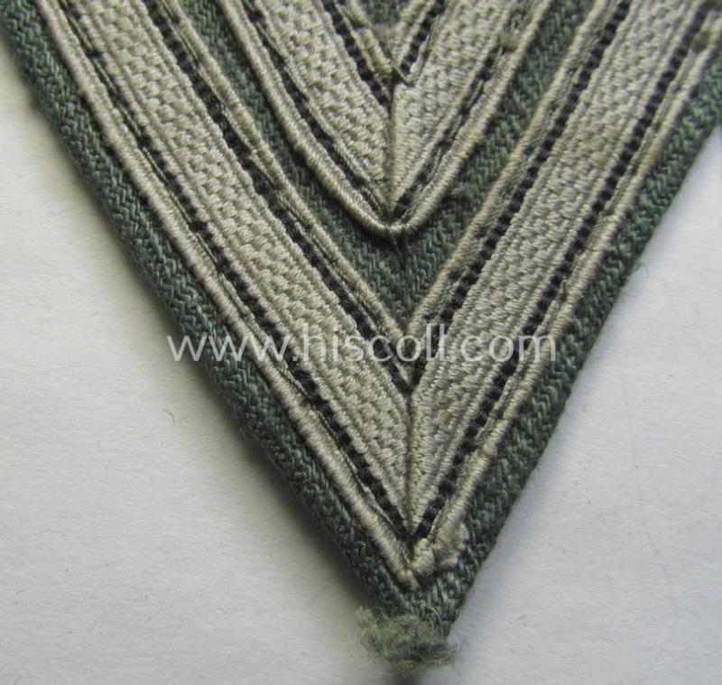 Neat, WH (Heeres ie. Waffen-SS) 'Armwinkel' (or: arm-chevron) as was executed on a greenish-coloured- and/or 'HBT'-like (ie. 'Drillich'-) based background as was specifically intended for usage by an: 'Obergefreiter' (ie. 'SS-Rottenführer')