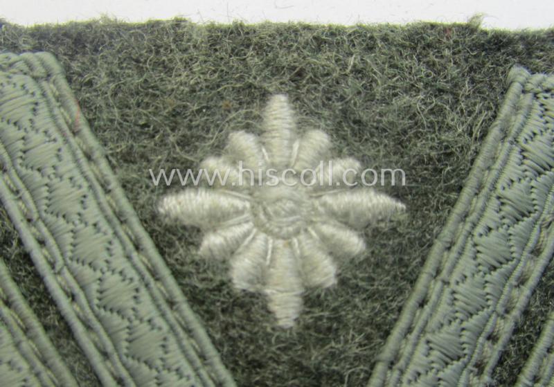 WH (Heeres) 'Armwinkel' (or: arm-chevron) as executed on typical field-grey-coloured wool as was specifically intended for usage by a soldier with the (unusually encountered!) rank of: 'Stabsgefreiter'