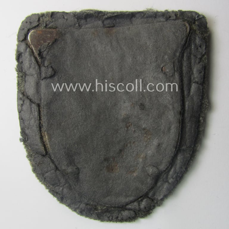 Attractive - truly worn and actually scarcely encountered! - WH (Heeres ie. Waffen-SS) 'Kuban'-campaign-shield that comes mounted onto its original field-grey-coloured- and/or woolen-based 'backing' as issued and/or used