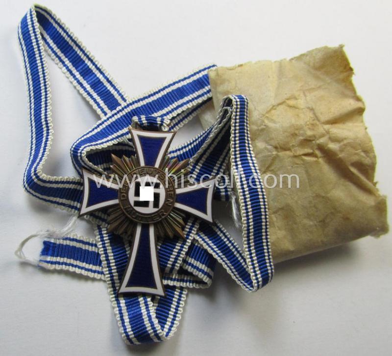 'Ehrenkreuz der Deutschen Mutter - Dritte Stufe' that comes in a 'virtually mint- ie. unissued', condition