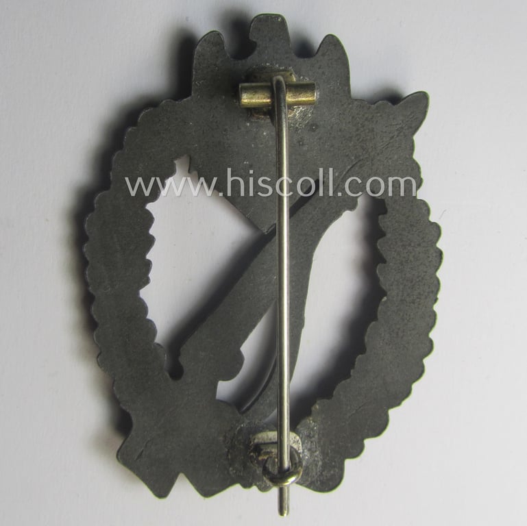 'Infanterie Sturmabzeichen in Silber' (or: silber-class infantry assault-badge ie. IAB) being a non-maker-marked, zinc- (ie. 'Feinzink'-) based example as was (I deem) produced by the: 'S.H.u.C.o.'-company
