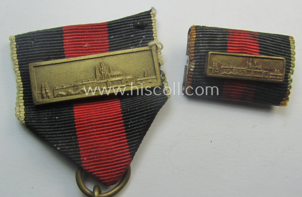 WH Czech-occupation- (ie. 'Anschluss'-) medal: '1. Oktober 1938' that comes with its period-attached 'PB-Spange' (and ribbon-bar) and that comes stored in its bordeaux-red-coloured- and/or non-maker-marked etui