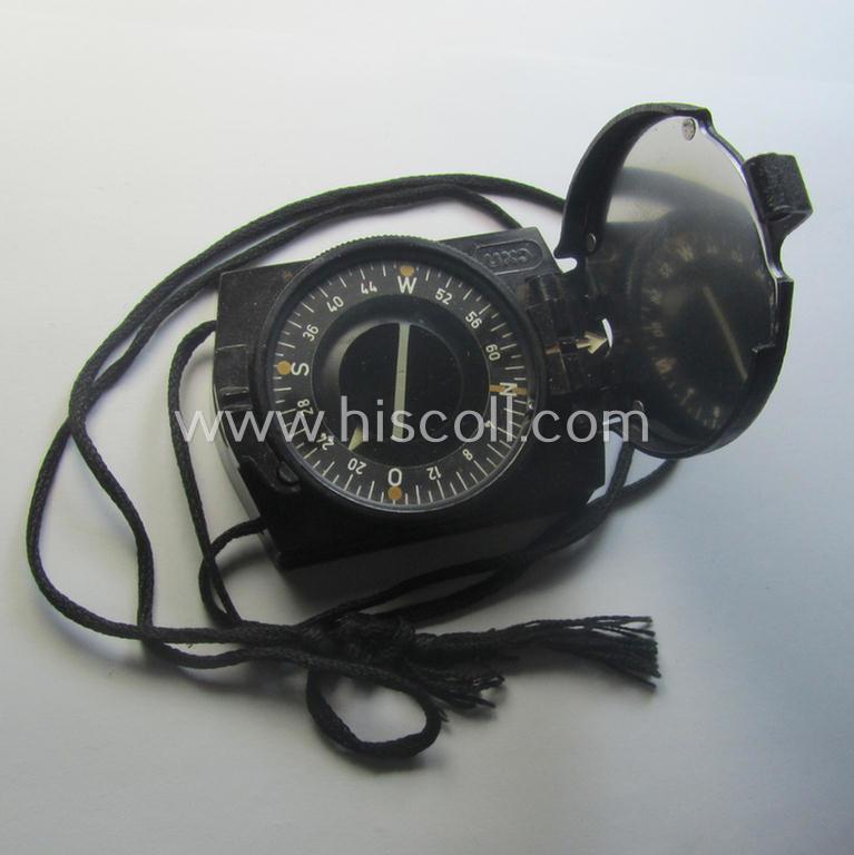 'Standard-issue'-pattern WH compass (or: 'Marschkompass') as executed in black-coloured 'Bakelite' being - I deem - a later-war-period- and/or maker- (ie. 'CXN'-) marked example that comes mounted on its period cord