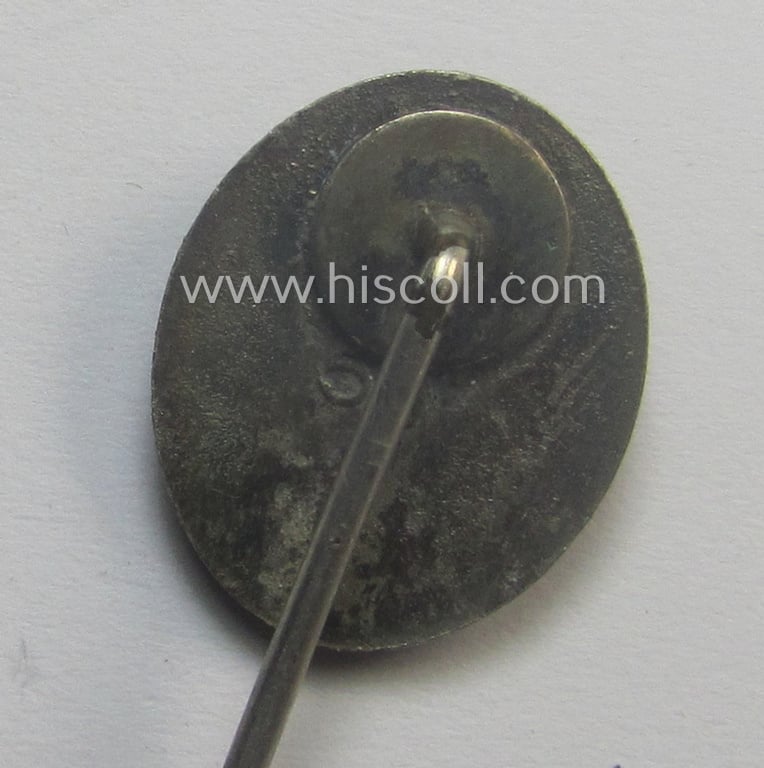 Complete, silver-class wound-badge- (or: 'Verwundeten-Abzeichen in Silber'-) set comprising of a maker- (ie. '65'-) marked example (and miniature!) as produced by the 'Hersteller' ie. maker: 'Klein u. Quenzer'