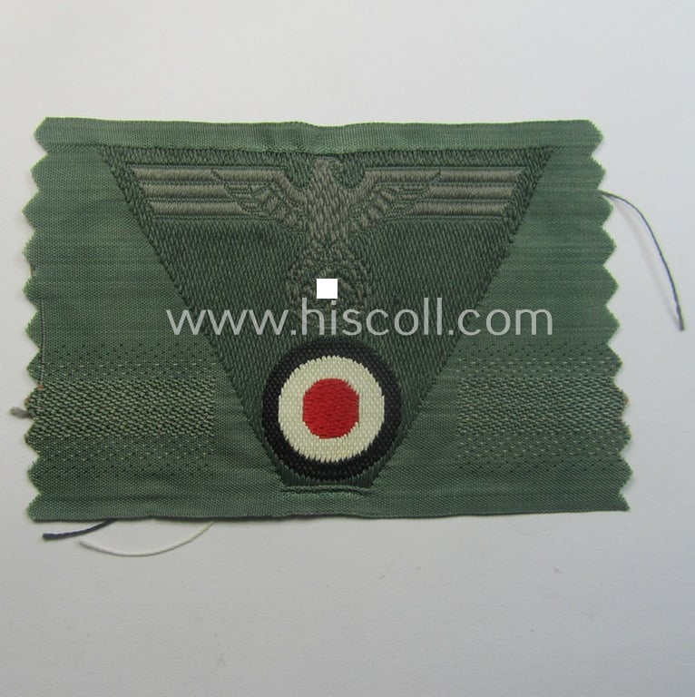WH (Heeres) so-called: 'M43-pattern') cap-eagle/cocarde (ie. cap-trapezoid) as was specifically produced for usage on the so-called: 'M-43'-model field-caps (ie. 'Einheitsfeldmützen')