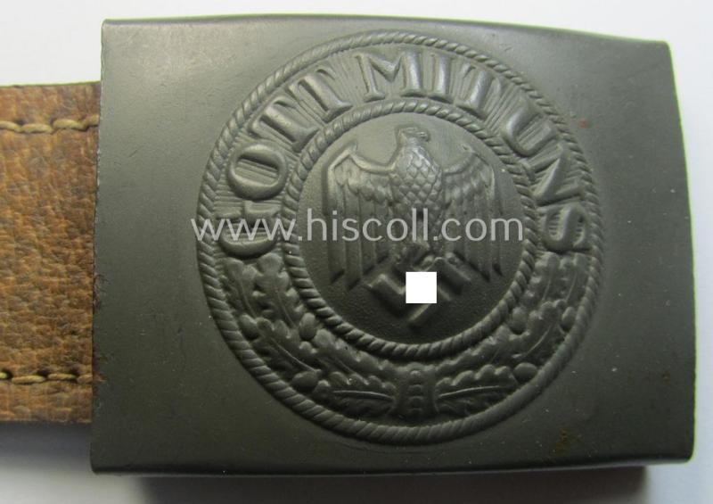 WH (Heeres) 'standard-pattern', field-grey-toned- and steel-based belt-buckle being a maker- (ie. 'H. Arld - Nuernberg'-) marked- and/or: '1942'-dated example that comes mounted onto its leather- (ie. 'pig-skin'-) based tab