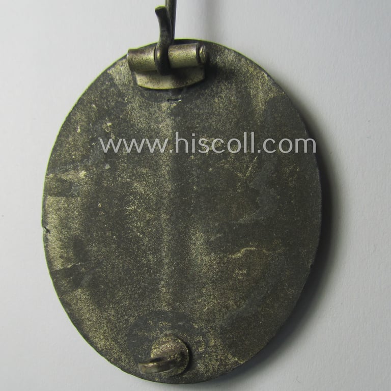 'Verwundeten-Abzeichen in Silber' being a non-maker-marked- and (I deem) mid-war-period zinc- (ie. 'Feinzink'-) based example as was produced by a (by me) unidentified maker