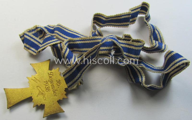 Attractive, 'Ehrenkreuz der deutschen Mutter - erste Stufe' (or: golden-class mothers'-cross) being a hardly used  example that comes mounted onto its accompanying, long-sized ribbon as issued and/or recently found