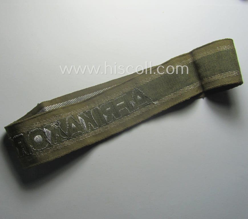 Minimally worn, 'BeVo'-like cuff-title (ie. 'Ärmelstreifen') entitled: 'Afrikakorps' being a with certainty issued example that comes in an overall very nice- (ie. non-shortened- and/or once tunic-attached-), condition