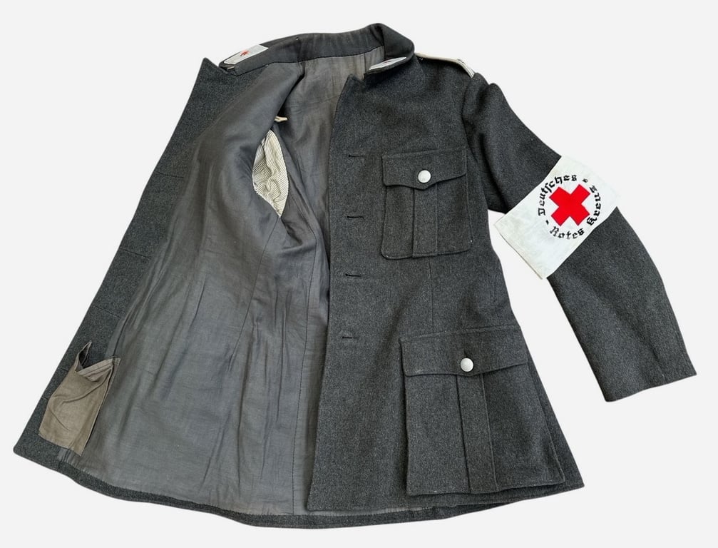 DRK (Deutsches Rotes Kreuz)  Vorhelfer service tunic with original insignia and armband.