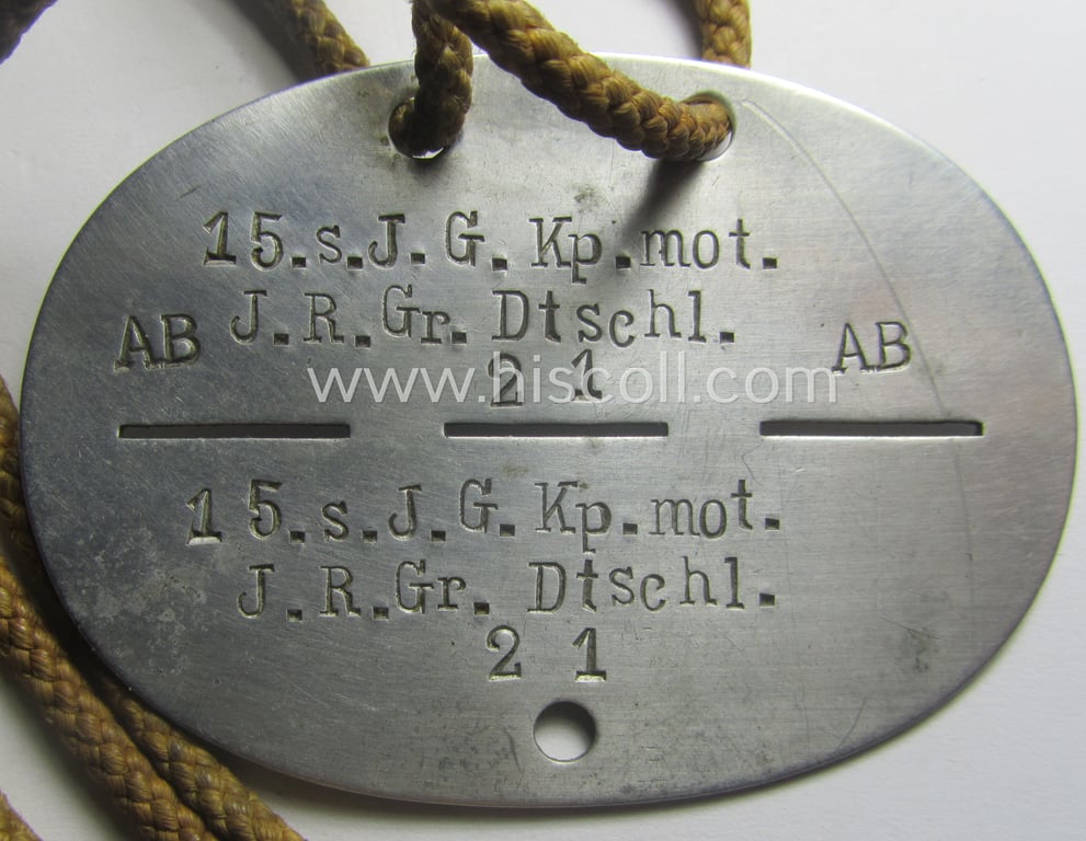Aluminium-based, WH (Heeres) 'Heeres-Infanterie'- ie. 'GrossDeutschland-Division'-related ID-disc bearing the clearly stamped unit-designation that simply reads: '15. s.J.G.Kp.mot.-J.R.Gr. Dtschl.' and that comes mounted onto its period cord as worn