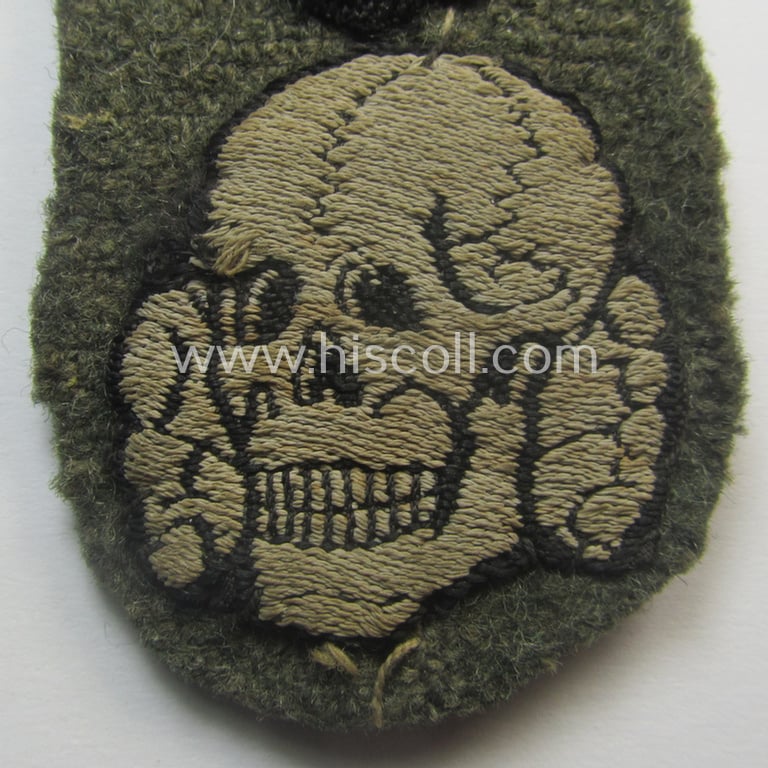 Superb - and rarely encountered! - Waffen-SS, 'BeVo'-woven-style skull- and cap-eagle-set (ie. 'Totenkopf- u. Adler-Effektensatz für Einheitsfeldmütze') that comes still mounted onto its front-piece of an 'M43'-type-cap (ie. 'Einheitsfeldmütze')