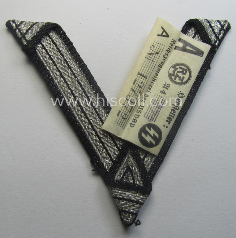 SS (ie. 'Allgemeine o. Waffen-SS') arm-insignia being an 'SS', so-called: 'Ehrenwinkel für Altgediente Kämpfer o. Angehörigen der SS' (or: honorary-chevron for old campaigners) still retaining its period 'RzM'-etiket