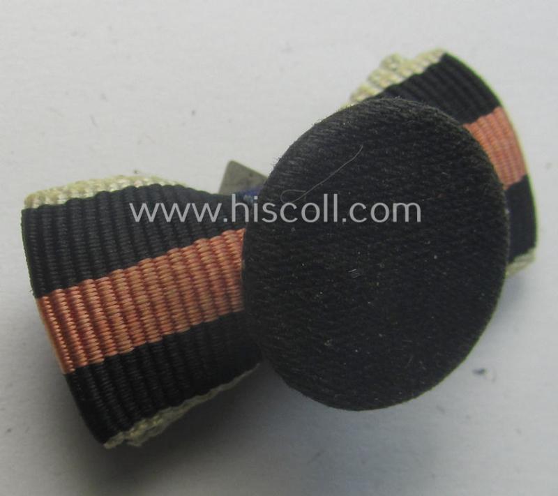 Interesting, 3-pieced WH (Luftwaffe) related ribbon-bar (ie. 'Feld- o. Bandspange') showing a: 'WH-DA 4. Stf.' and an Austrian- and/or Czech 'Anschluss'-medal and that comes mounted onto its specific 'button-hole'-set-up