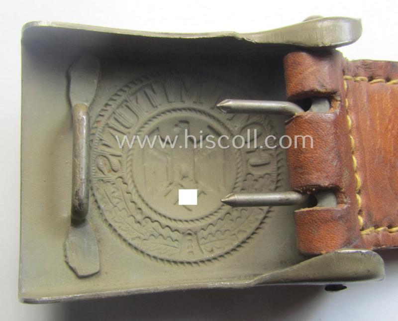 'Stonemint', WH (Heeres) 'standard-issue'-pattern, field-grey-toned- and/or steel-based belt-buckle being a maker- (ie. 'Brüder Schneider A.G.'-) marked- and/or: '1940'-dated example that came mounted onto its leather-based tab