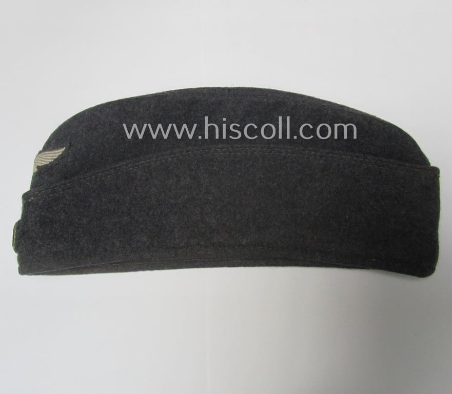 Attractive - albeit moderately used- ie. worn - WH (Luftwaffe) bluish-grey-coloured, EM- (ie. NCO-) type side-cap (ie. 'Schiffchenmütze für Mannschaften u. Unteroffiziere der Luftwaffe')