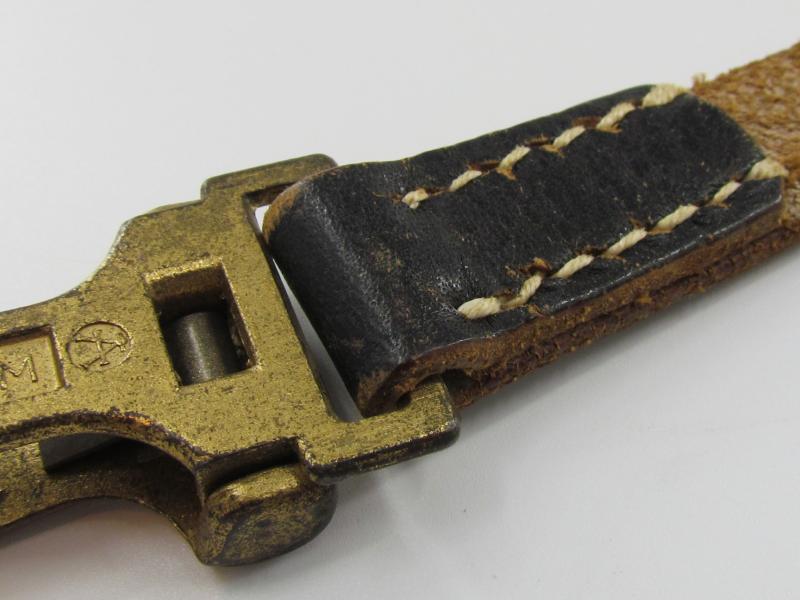 Leather shoulder strap marked DRGM