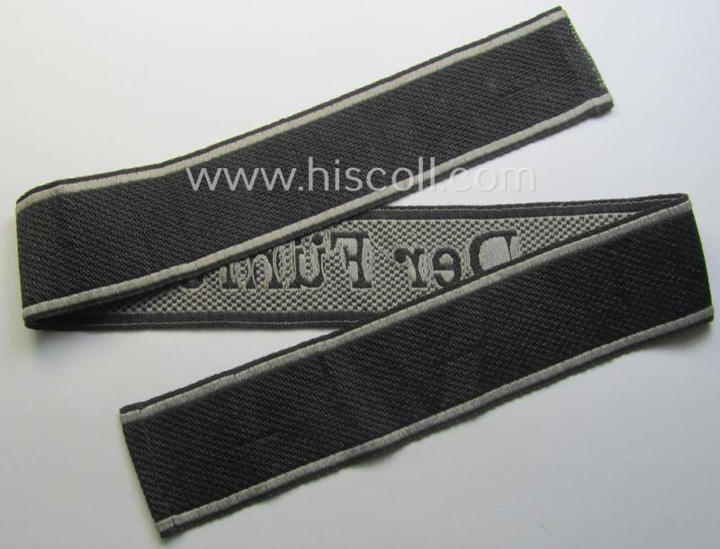 Waffen-SS, 1943-pattern cuff-title (ie. 'Ärmelstreifen') depicting the machine-woven Latin script text in silver-grey linnen as was specifically intended for usage by a member of the: 'SS-Regiment “Der Führer”