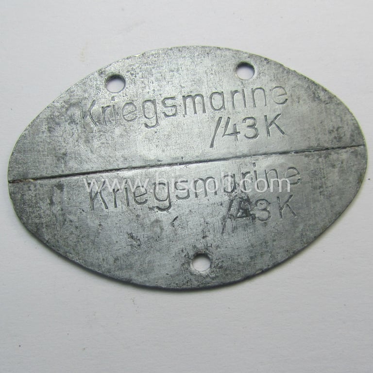 Interesting, zinc- (ie. 'Feinzink'-) based, female-staff-related ID-disc (ie. 'Erkennungsmarke') bearing the stamped unit-designation: 'Marinehelfer - 10466'