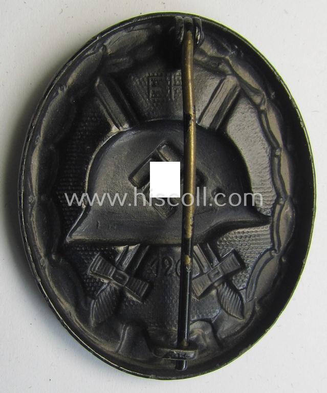 Neat, dual-maker- (ie. 'E.H.'- and/or: '126'-) marked example of a black-class wound-badge (or: 'Verwundeten-Abzeichen in Schwarz') being an example that was produced by the maker (ie. 'Hersteller') named: 'Eduard Hahn'