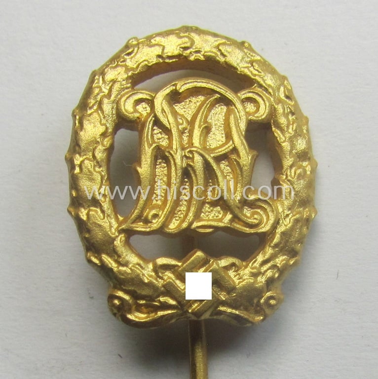 Superb, 'Reichssportabzeichen DRL in Gold' (or: golden-class DRL sports'-badge) being a maker- (ie. 'Wernstein - Jena'-) marked example and that comes with its accompanying miniature