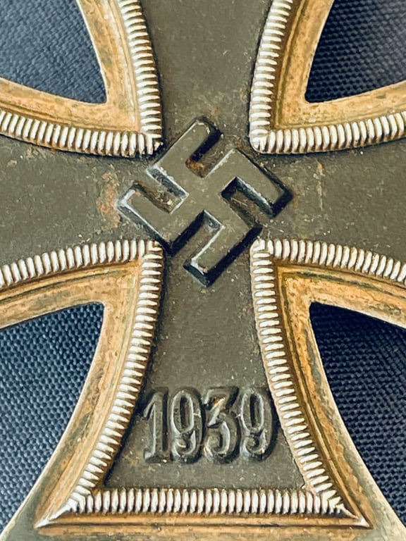 RARE CONCURVED WWII 1ST CLASS IRON CROSS STAMPED NUMBER 4, STEINHAUER & LUCK OF LUDENSCHHELD.