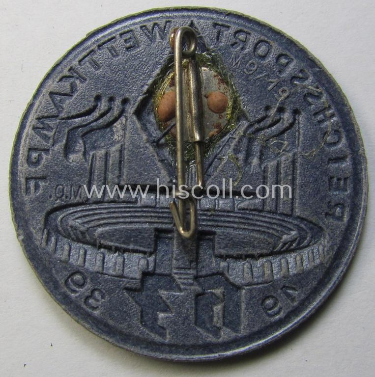 Commemorative - bluish-grey-coloured and/or: carton-based(!) - 'HJ'- (ie. Hitlerjugend-) related 'tinnie' depicting a sports-complex and 'HJ-Raute' and showing the text: 'Reichssport Wettkampf HJ - 1939'