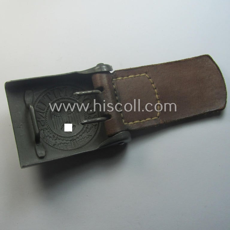 'Virtually mint', 'standard-issue'-pattern, WH (Heeres) field-grey-toned- and steel-based belt-buckle being a maker- (ie. 'H.A.41'-) marked example that comes mounted onto its: 'H. Arld - Nürnberg'-marked and/or: '1942'-dated tab