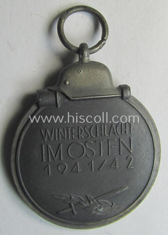 Attractive medal-set: 'Winterschlacht im Osten 1941-42' being a maker- (ie. '110'-) marked- (and/or 'Feinzink'-based) specimen by the maker: 'Otto Zappe' and that comes together with its (non-confectioned) ribbon (ie. 'Bandabschnitt')