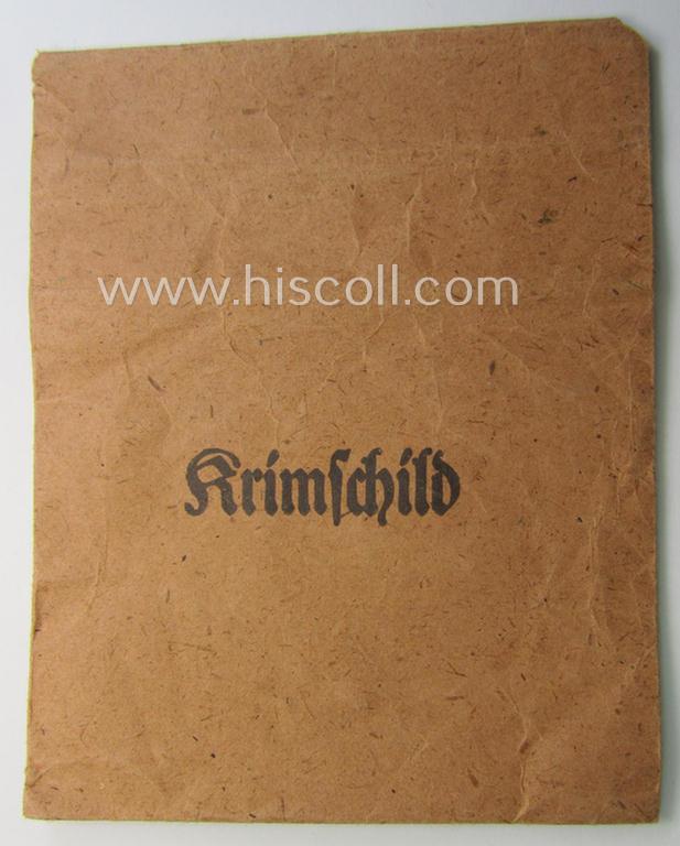 WH (Heeres ie. Waffen-SS) 'Krim'-campaign-shield (by the maker: 'Friedrich Orth') that comes stored in its period (and rarely seen!) 'Zellstoff'-based pouch and that comes in a probably issued- (albeit still 'virtually mint'-), condition