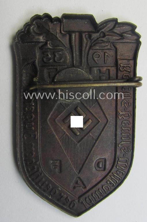 Commemorative, golden-bronze-toned, 'DAF'/'HJ'- (ie. 'Deutsches Arbeits Front o. Hitlerjugend'-) related 'tinnie' being a non-maker-marked example depicting a: 'HJ-raute' and text: 'Reichs-Berufs-Wettkampf der deutschen Jugend 1935'