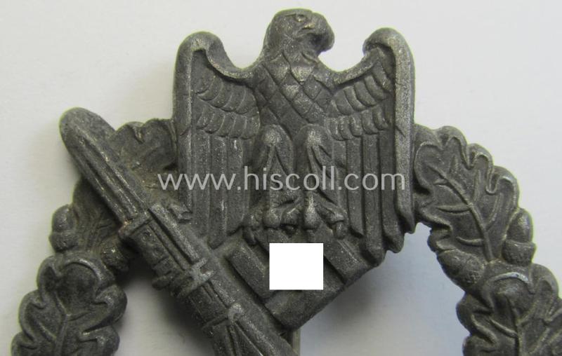 Attractive, 'hollow-back'-pattern 'Infanterie Sturmabzeichen in Silber' (or: silver infantry-assault badge ie. IAB) being a non-maker-marked example as executed in zinc-based metal (ie. 'Feinzink') as was produced by the: 'Wilh. Deumer'-compa...