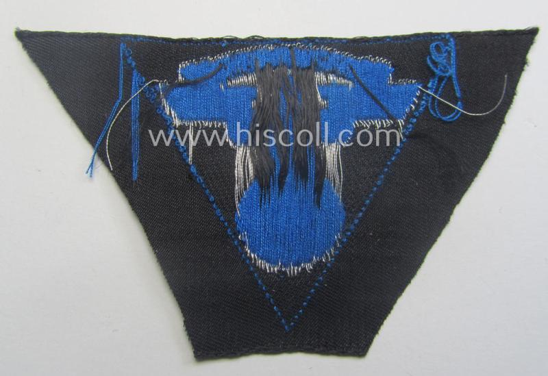 Never used - ie. 'virtually mint'! - so-called: N.S.K.K. (ie. 'National Soc. Kraftfahr Korps') side-cap-eagle (ie. 'Adler für Schiffchenmütze') being a 'flat-wire-woven'-example that comes mounted onto a cornflower-blue-coloured background