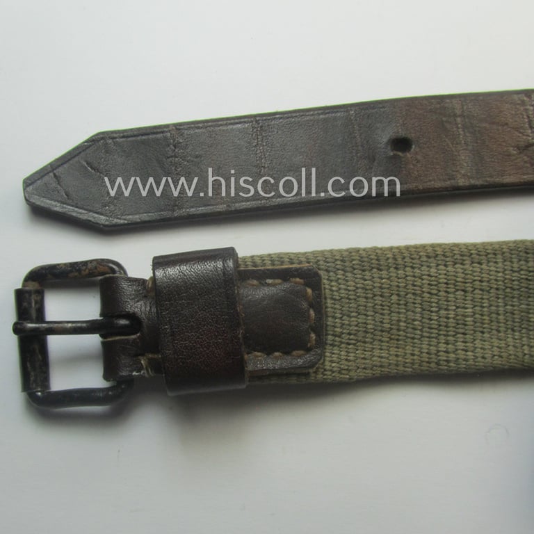 'Standard-issue'-pattern, WH trousers'-belt (or: 'Riemen für Hosen') as was executed in a combination of woven, field-grey-coloured linnen and/or brownish/black-coloured leather