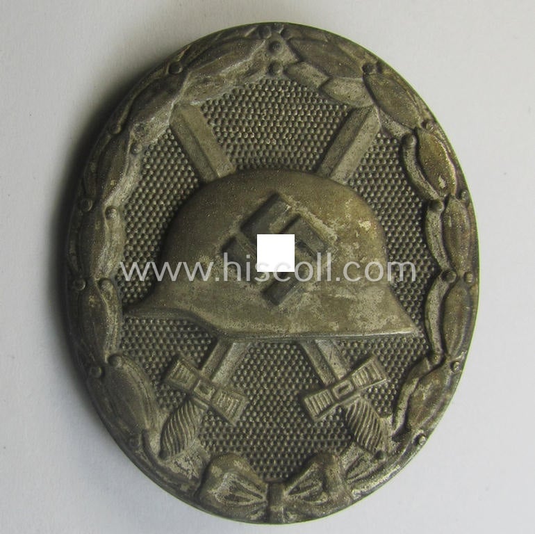 'Verwundeten-Abzeichen in Silber' being a clearly maker- (ie. '30'-) marked- and/or typical 'Feinzink'-based example that comes stored in its maker- (ie. 'Hauptmünzamt Wien III'-) marked- and period etui