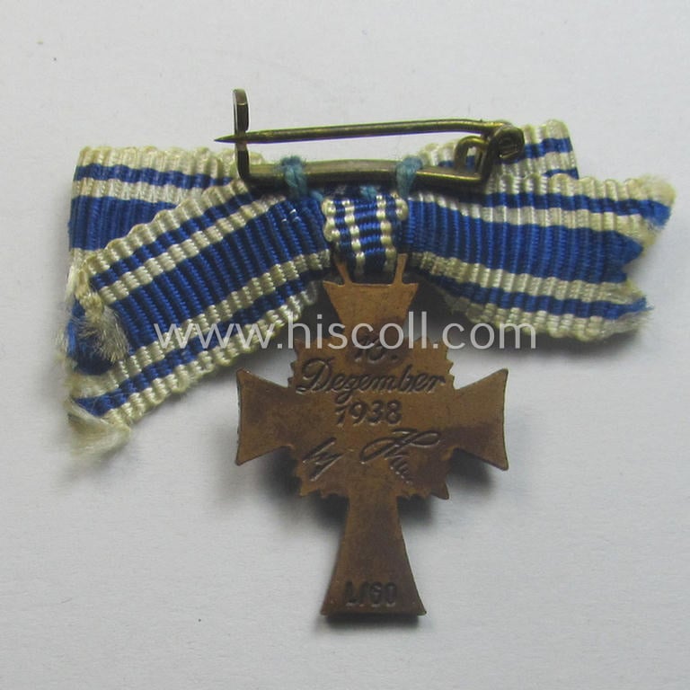 Attractive, 2-cms.-sized miniature of a maker- (ie. 'L/60'- ie. by 'GB'-) marked: 'Ehrenkreuz der Deutschen Mutter in Bronze' that came stored in its non-maker-marked, two-pieced bordeaux-coloured 'LDO'-type box (ie. etui)