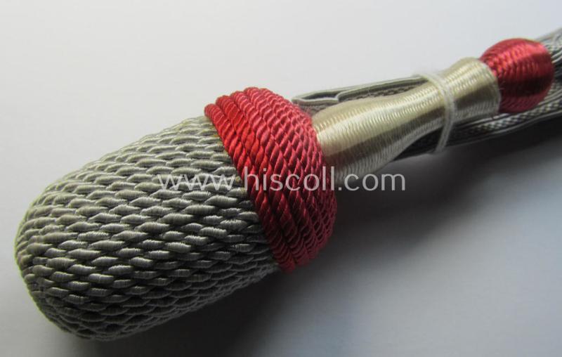 Attractive, red-, white- and red-coloured EM- (ie. NCO-) type side-arm knot (ie. 'Portepee' ie.: 'Troddel') as was used for the various WH-bayonets and that comes in an overall very nice- (ie. 'virtually mint- ie. unissued'-), condition