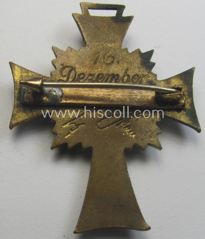 Regrettably damaged (ie. relic) 'Ehrenkreuz der deutschen Mutter - dritte Stufe' (or: bronze-class mothers'-cross) being a non-maker-marked example that comes mounted onto a (period-attached) 'clasp'