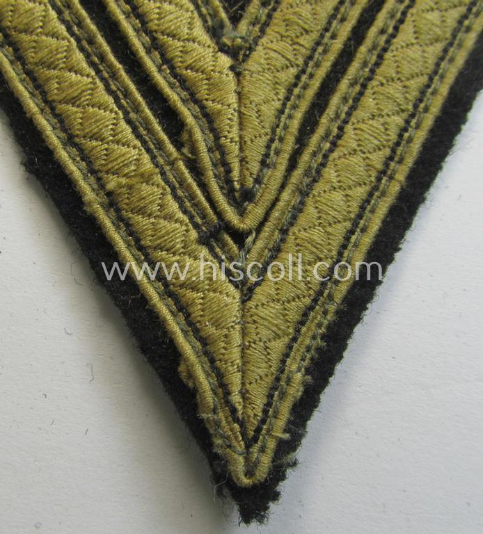 Waffen-SS-type 'Armwinkel' (or: rank-chevron) as executed on black-coloured wool as was specifically intended for usage by an SS-soldier with the rank of: 'SS-Rottenführer'