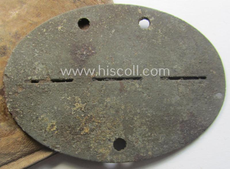 Zinc-based, WH (Heeres-) ie. 'Gebirgsjäger'-related ID-disc (ie. 'Erkennungsmarke') bearing the clearly stamped unit-designation that reads: '8./G.J.R. 137' and that comes stored in its leather-based pouch as issued and found