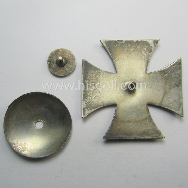 WWI-period Iron Cross 1st class (or: 'EK 1. Klasse') being a typical non-maker-marked example (by the 'C.E. Juncker'-company!) that comes mounted onto its (unusual!) and functional 'screw-back'- (ie. 'an der Schraube'-) set-up