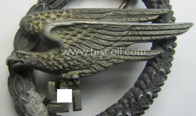 Zinc- (ie. 'Feinzink'-) based version of a WH (Luftwaffe) 'Fallschirmschützen-Abzeichen' (being a maker-marked, 'Type A'-pattern example as was produced by the 'G.H. Osang'-company)