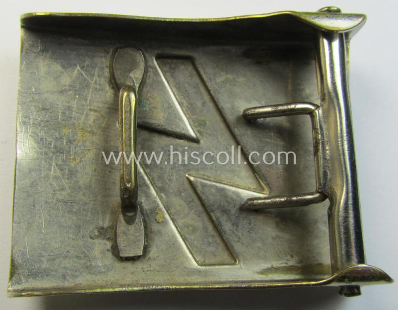 Attractive, DJ (ie. 'Deutsches Jungvolk') silver-coloured- (ie. typical nickle-chromed) belt-buckle (ie. 'Koppelschloss') being a non-maker-marked example of the 'thin-shaped-rune-variant'-pattern and that comes in an overall nice condition