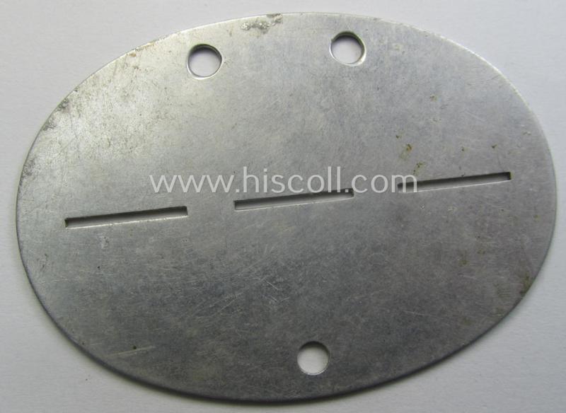 Aluminium-based, WH (Heeres-) ie. 'Gebirgsjäger o. Nachrichten'-related ID-disc (ie. 'Erkennungsmarke') bearing the clearly stamped unit-designation that reads: 'Geb.Jäg.Nachr.Ers.Kp.1' and that comes as issued and found