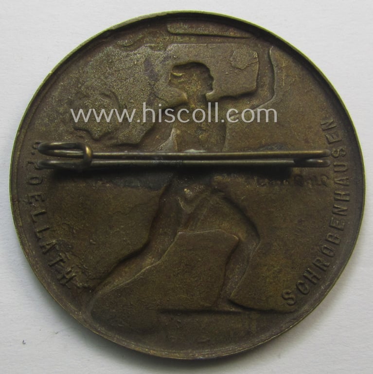 Commemorative, golden-bronze-toned, so-called: 'N.S.D.A.P'-related day-badge (ie. 'tinnie') showing a detailed illustration of a sportsman and showing the text (ie. dates): '24-2-1934 - 24-2-1920'